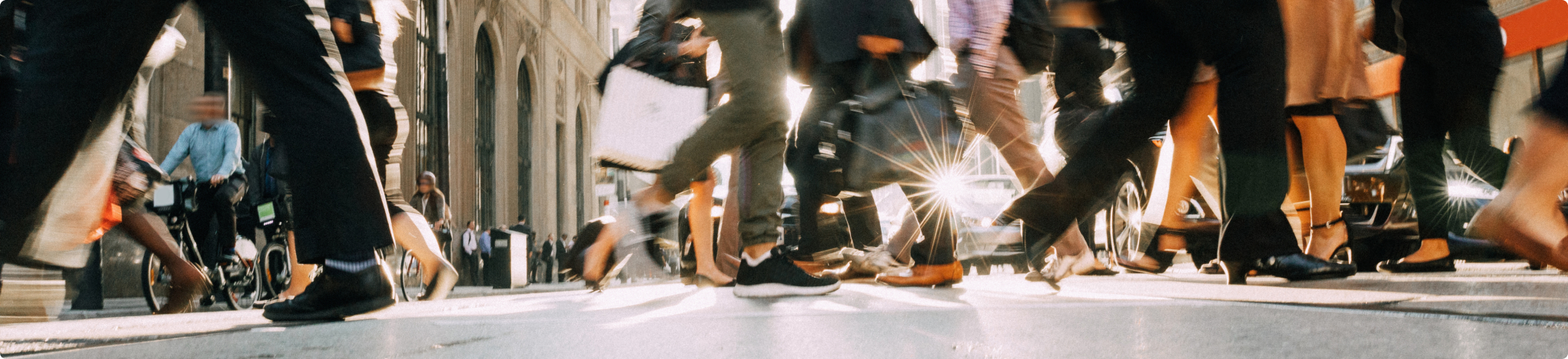 photograph of people walking on a busy street