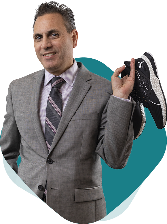 Photo of Tax Specialist and Partner Joe Gervasi, CPA, CA, TEP holding his running shoes