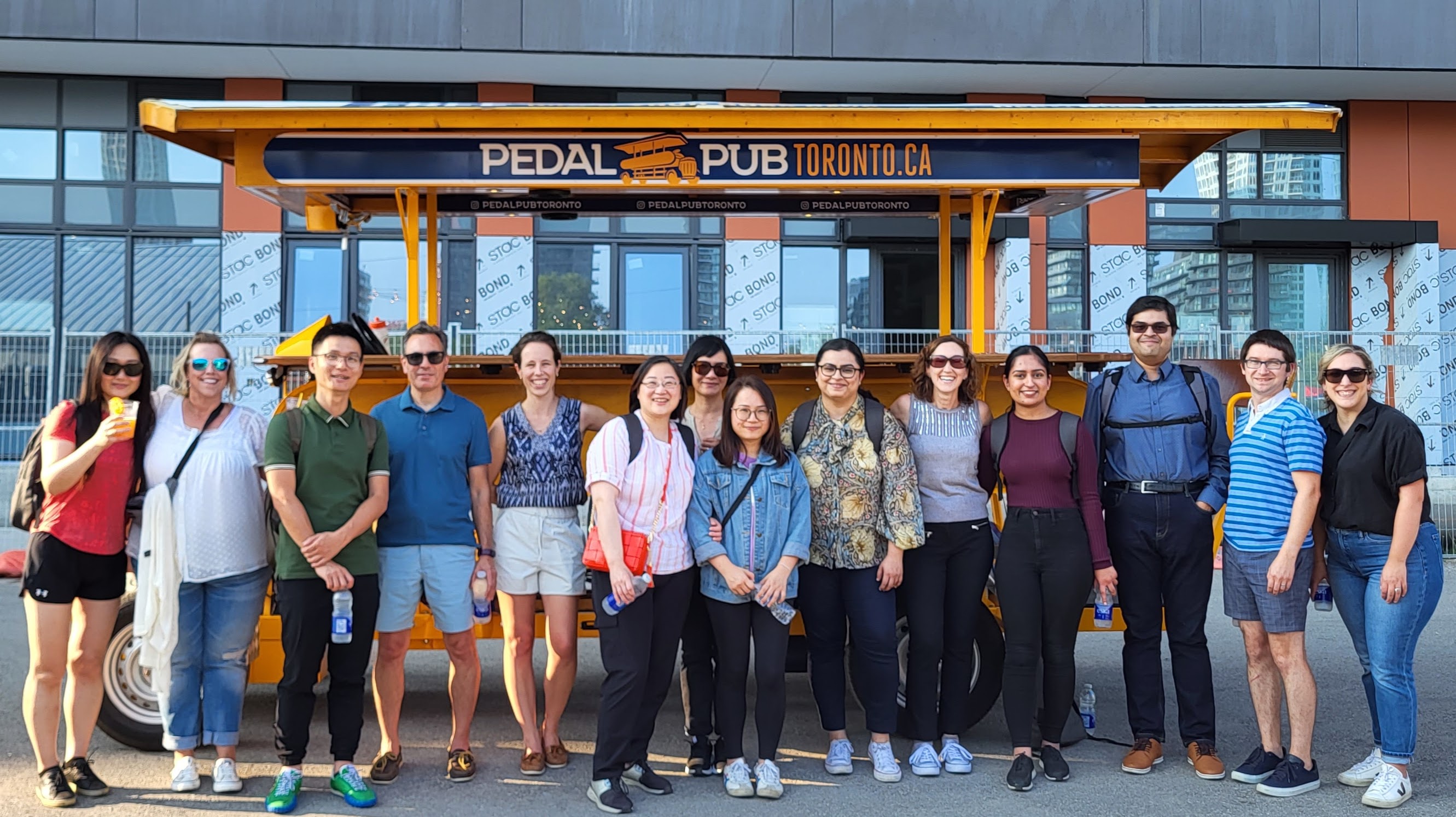 Stern Cohen team in front of a trolley car in Toronto