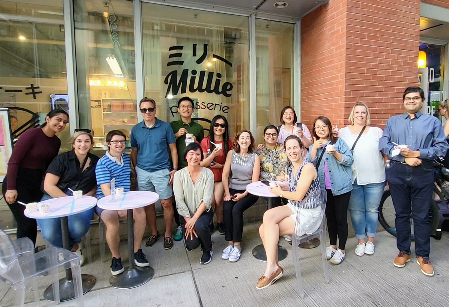 Stern Cohen staff members sitting in front of an ice cream shop in Toronto